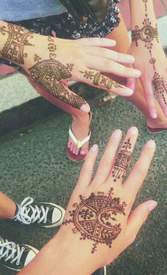 Photo of Westport middle schoolers with henna tatoos.