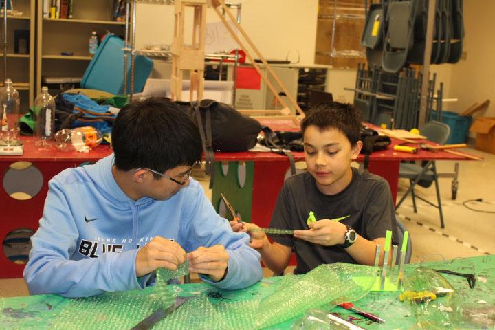 Augustin Liu and  Tyler Edwards are make bottle rockets in preparation for States.