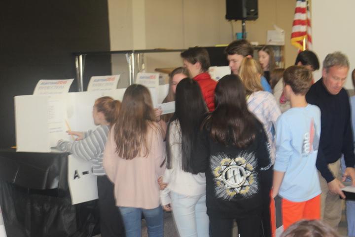 Students lined up during lunch to cast their votes for the president. 