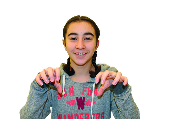 An 8th grader showing the hands that have developed a strong climbing grip.