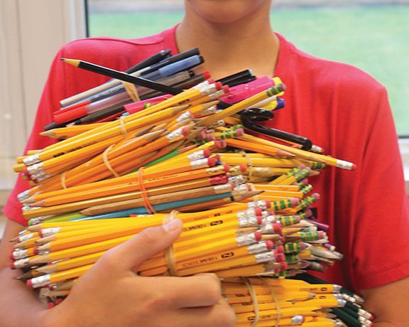 The writer with his collection of pencils collected over one year.