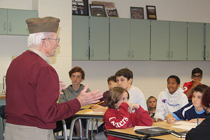 Leonard Everett Fisher WWII Veteran and author telling student about his service on Friday before Veteran’s Day at an eighth grade classroom. Moments like this will occur in Zoom meetings this year.