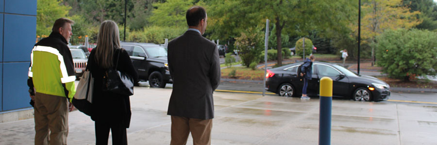 Coleytown security officer Terry Moran, paraprofessional Sary Reid and Bedford Principal Adam Rosen watch as students arrive at Bedford for the first day of the joining much of Westport's two middle schools into one.