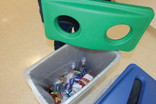 The round holes means bottles and cans in that bin, but students and staff  mix trash which makes separating materials difficult and recycling less effective.