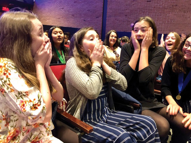 Cara Feeley, Addie Purcell and Mim Hurley reacting to the news that they earned a first place finish and are going to compete at States.