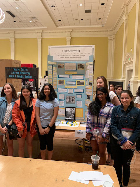 Eighth+graders+at+the+NHD+finals+with+club+adviser+Caroline+Davis.+Their+project+addressed+scientist+Lise+Meitner%E2%80%99s+lack+of+credit+for+her+research.