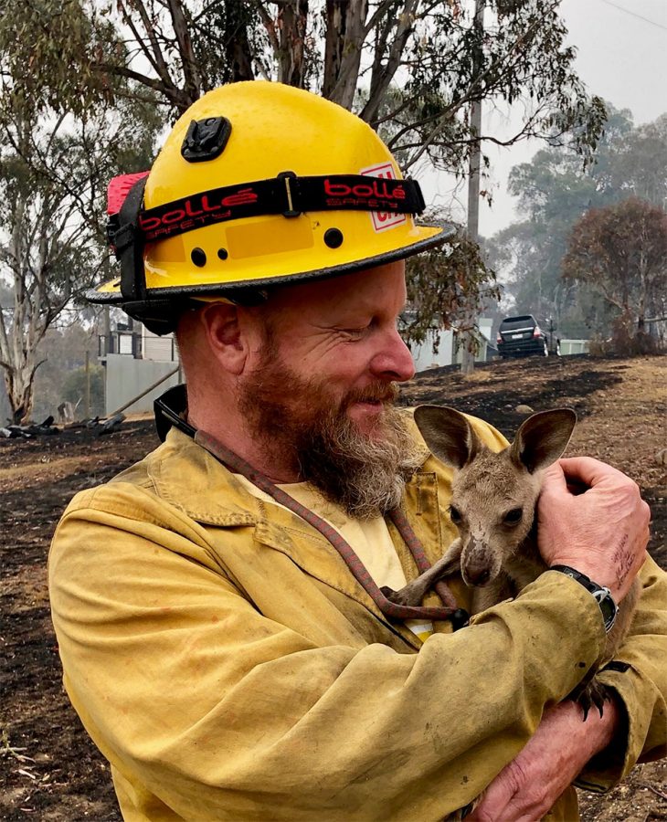 Captain Soldavini with baby kangaroo in January. The fires have destroyed homes, and they have killed people and wildlife.