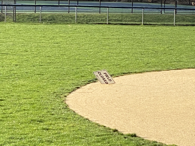 A Field Closed sign on Rogers Field serves as a reminder of baseball on hold. While a similar sign has been positioned on Compo Beach Field since the summer, the notices have proliferated across town as the Westport Parks and Recreation Department closed the rest of their baseball fields.