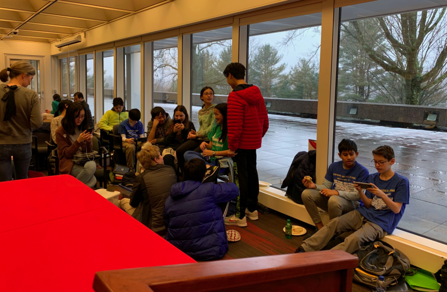 Groups of Bedford Middle School Science Olympiad students joke around, study to prepare for their events, and help each other out.