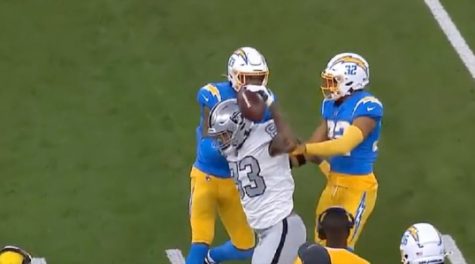 Darren Waller spikes the ball after getting a first down in the Raiders week four Monday Night Football game against the Chargers. He was charged with a 15-yard penalty for taunting, and fans are not happy.