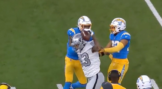 Darren Waller spikes the ball after getting a first down in the Raiders week four Monday Night Football game against the Chargers. He was charged with a 15-yard penalty for taunting, and fans are not happy.